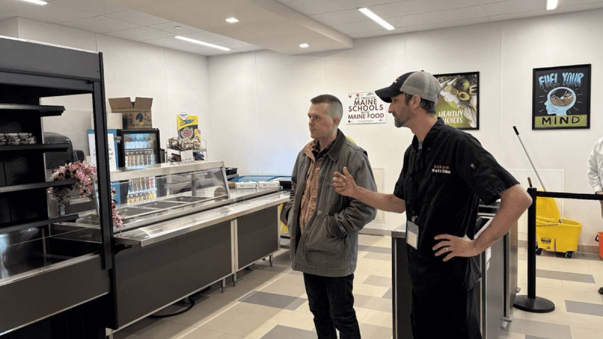 January 29, 2025: Congressman Jared Golden, ME-02, talks with Auburn School Nutrition Director Chris Piercey during tour of Edward Little High School.