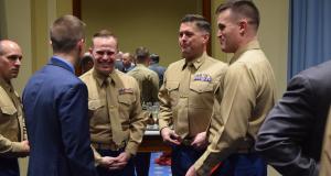 Congressman Golden speaks with service members.