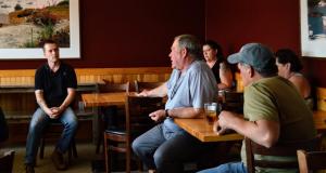 Congressman Golden sits down and speaks with people.
