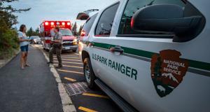 A Park Ranger consults with a park visitor while responding to a medical call on top of Cadillac Mountain while on duty in Acadia National Park, ME. Photo by: Will Newton/Friends of Acadia/NPS