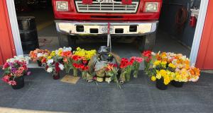 Memorial for firefighter Andrew Cross outside of the Morrill Volunteer Fire Department on Saturday morning. (Dylan Tusinski/Portland Press Herald)
