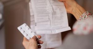 person holding drug label