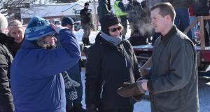 Congressman Golden speaks with two constituents.