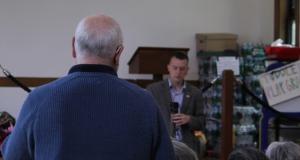 Congressman Jared Golden talking to a constituent.