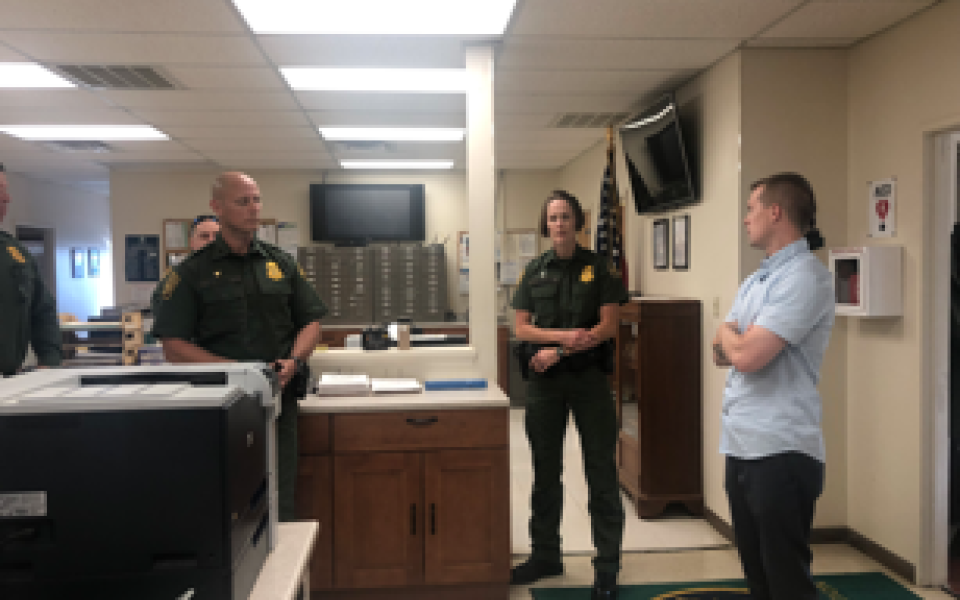Congressman Jared Golden with two officers.