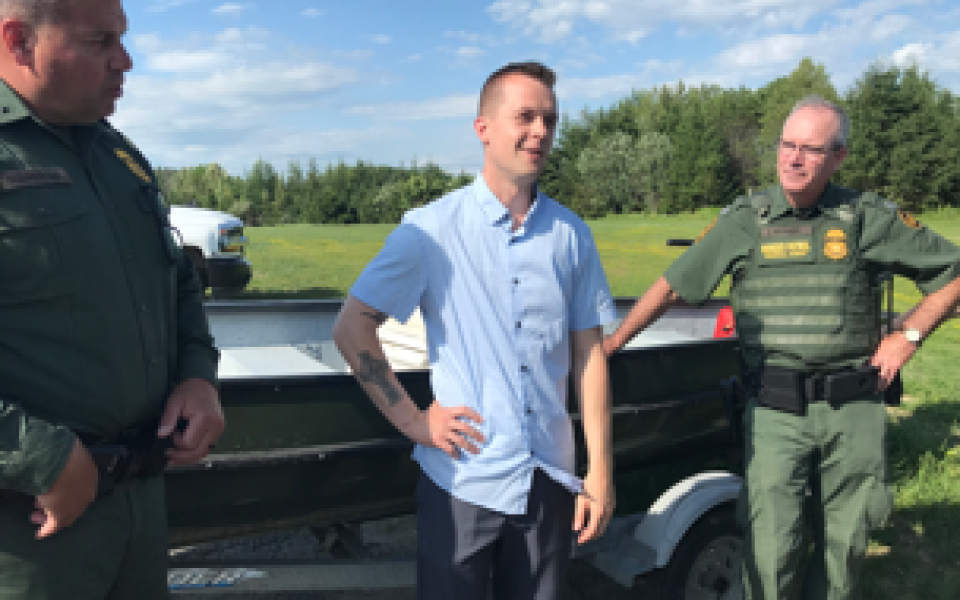 Congressman Jared Golden with two people.