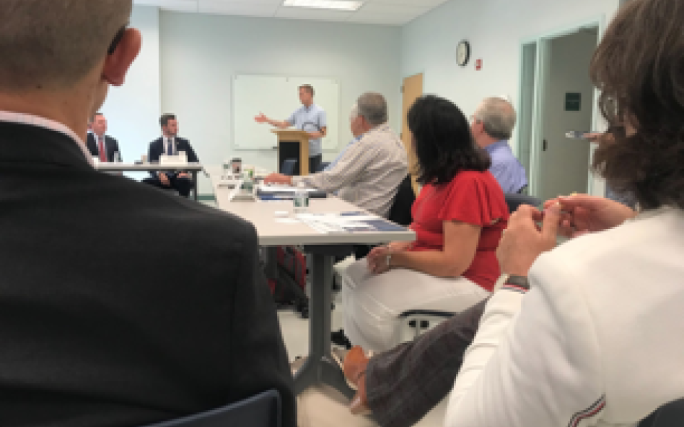 Congressman Jared Golden speaking to the room.