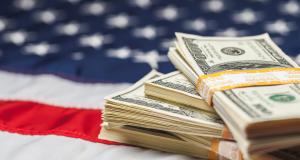 stock photo of dollars on American flag