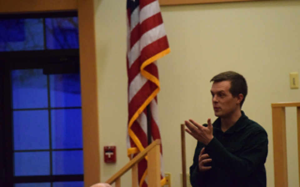 Congressman Jared Golden speaking at his Farmington Town Hall.