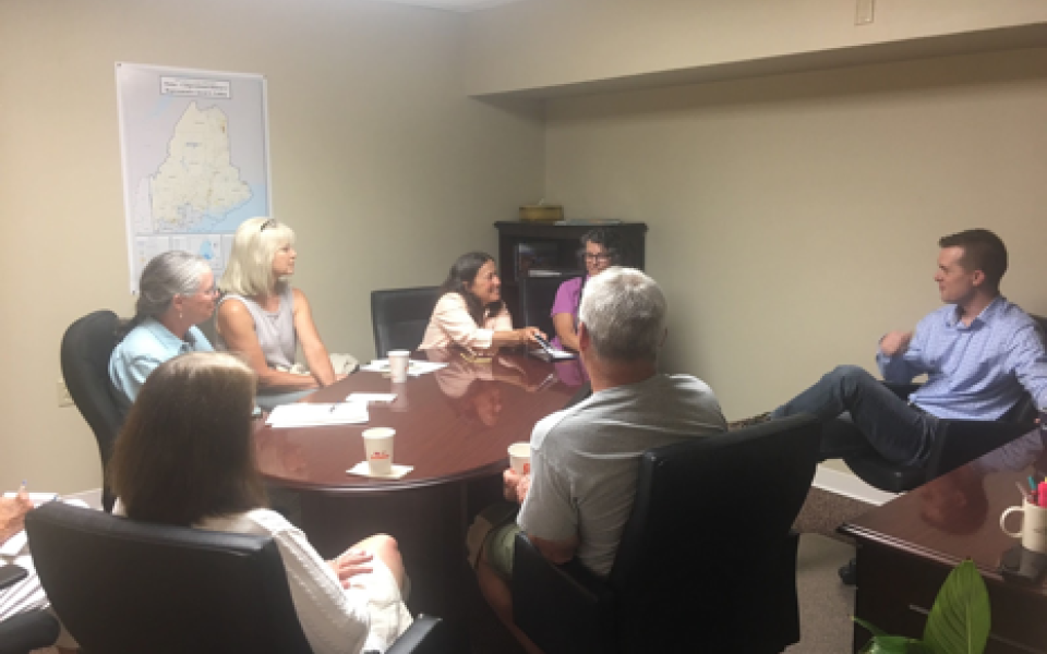 Congressman Jared Golden speaks at a table.