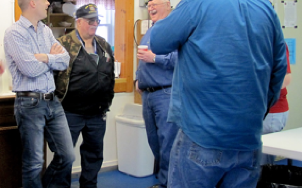 Congressman Jared Golden speaks with veterans.