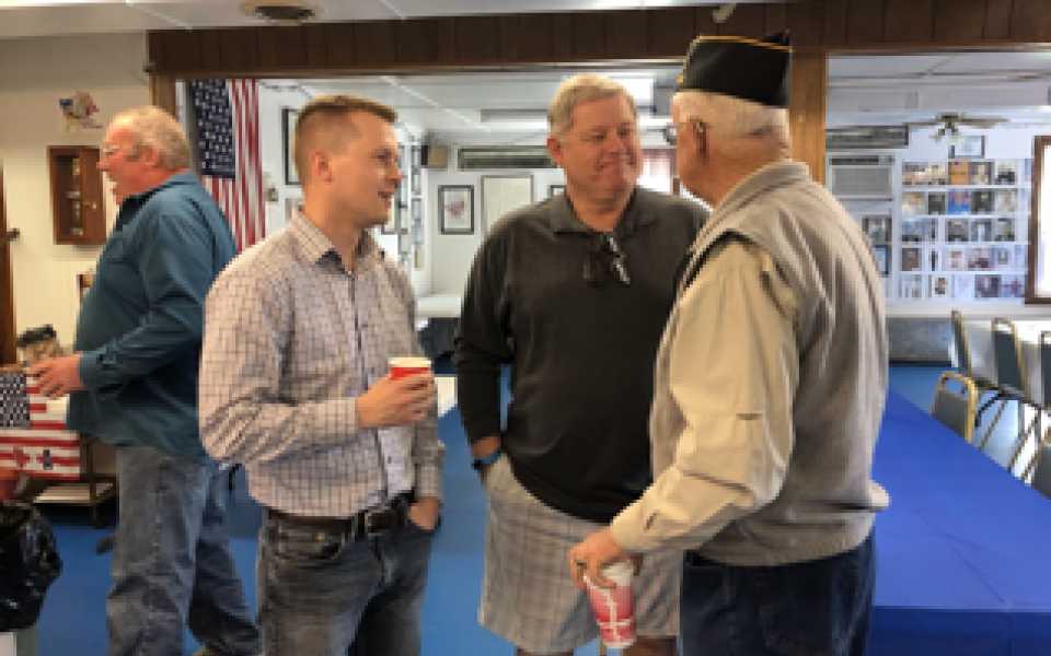 Congressman Jared Golden with two people.