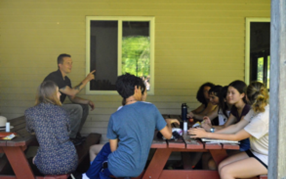 Congressman Jared Golden talking to kids.