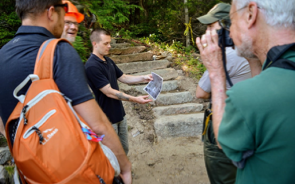 Congressman Jared Golden with people hiking.