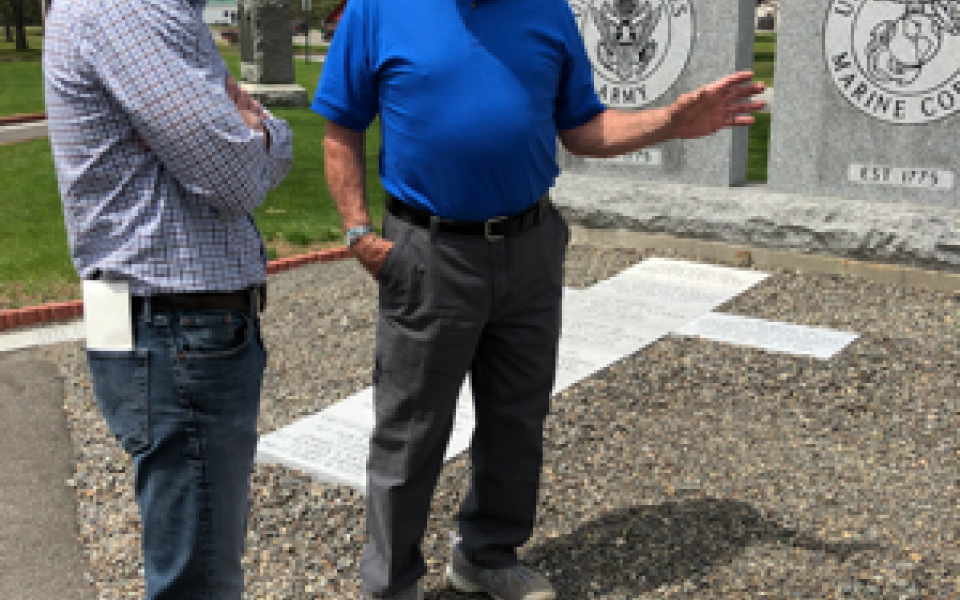 Congressman Golden speaking with a gentleman.